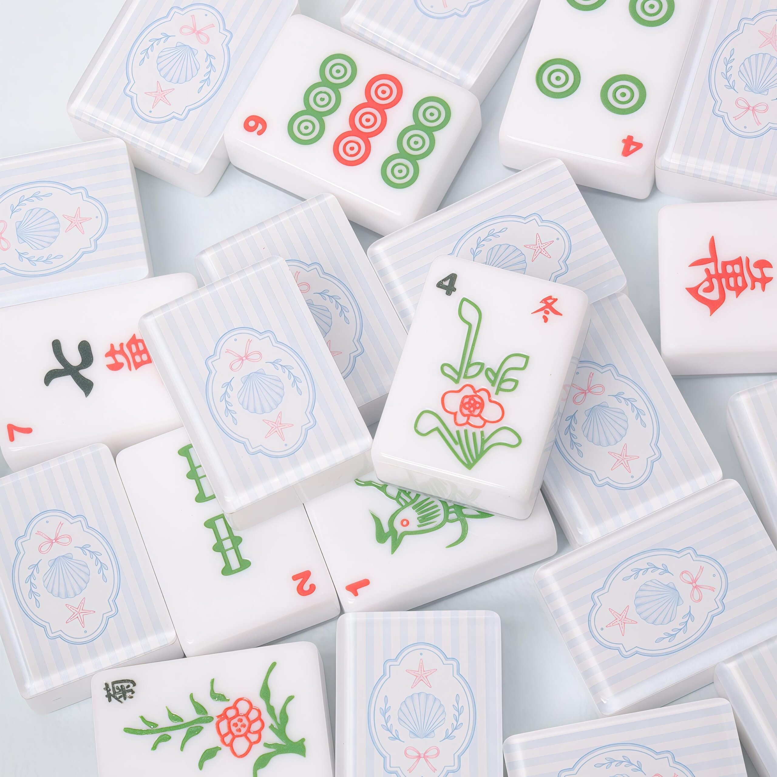 Blue striped seashell American Mahjong tiles with coastal artwork